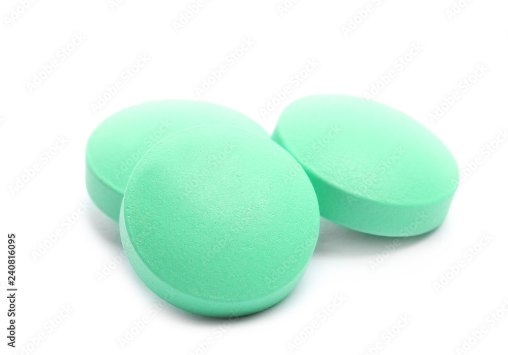 Pile of color pills on white background Pile of color pills on white background