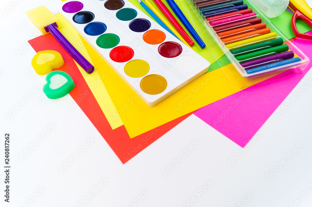 School accessories are laid out in the form of a rainbow. white background. School accessories are laid out in the form of a rainbow. white background.