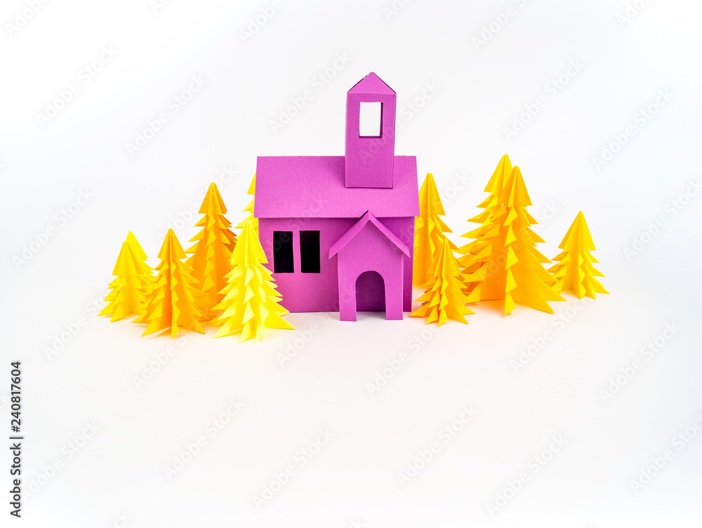 Purple house glued out of paper stands in the yellow forest. Purple house glued out of paper stands in the yellow forest.