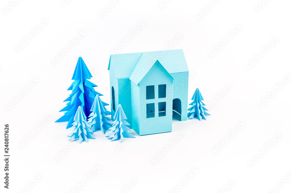 Blue house glued out of paper stands in the Violet forest. Blue house glued out of paper stands in the Violet forest.