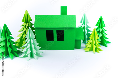 Green house paperwork standing on a white background. Paper craft.
