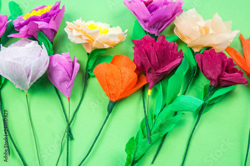 tools making crepe paper flowers green background