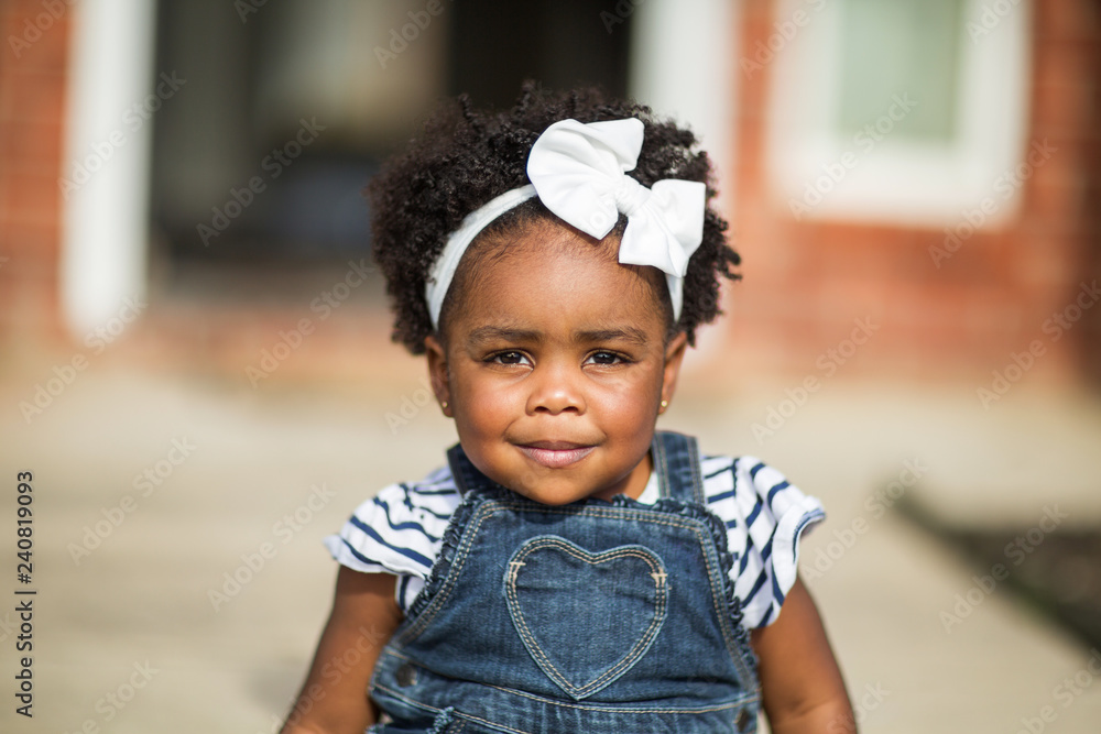 Happy little girl laughing and smiling outside. Happy little girl laughing and smiling outside.