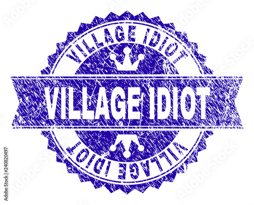 VILLAGE IDIOT rosette stamp seal imprint with grunge style. Designed with round rosette, ribbon and small crowns. Blue vector rubber watermark of VILLAGE IDIOT label with retro style.