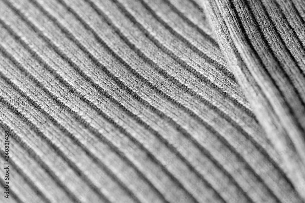 Gray knitwear as a texture and background close up Gray knitwear as a texture and background close up