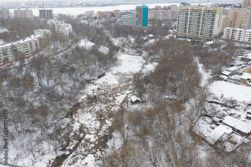 city small river in winter