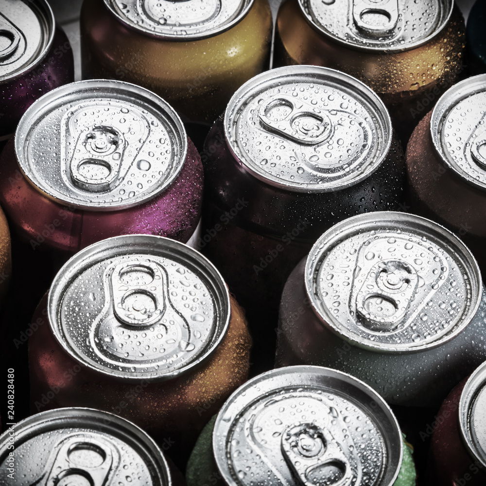 aluminum cans of soda background. view from the top. Toned image aluminum cans of soda background. view from the top. Toned image
