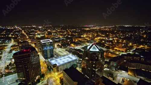 North Carolina Greensboro Aerial v2� Panning night view around downtown with detail of tallest buildings and park 10/17 photo