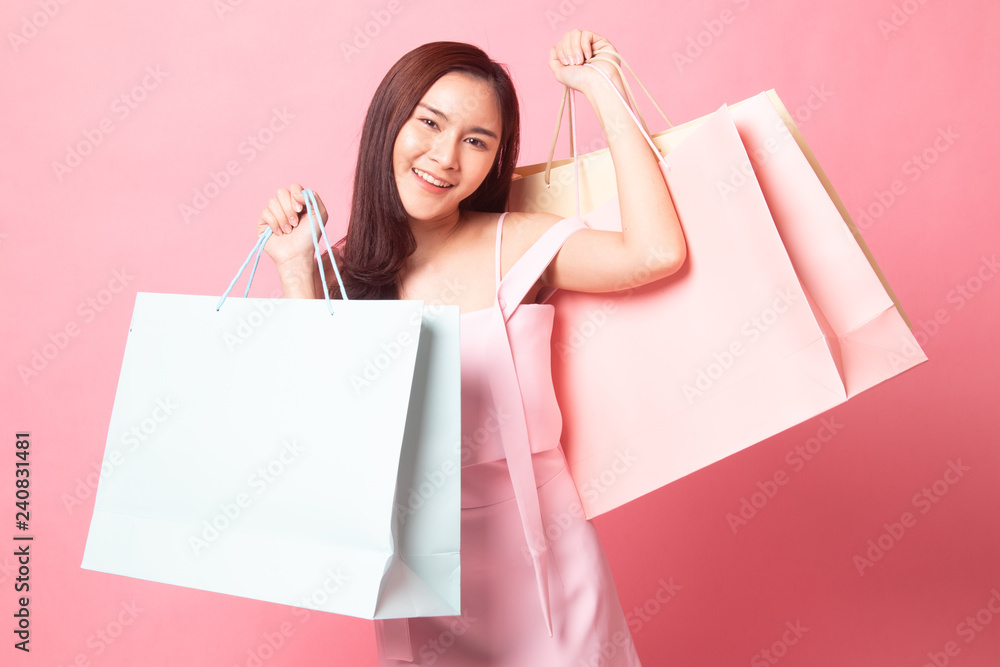 Young Asian woman with shopping bag.