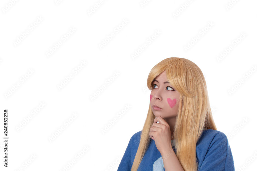 Cute young girl in star cosplay with hearts on cheeks thinking isolated 