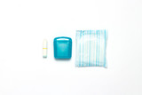 Feminine hygiene tampons, box for shipping and storage and sanitary pad on a white background. Concept of feminine hygiene during menstruation, choice between pads and tampons. Flat lay, top view