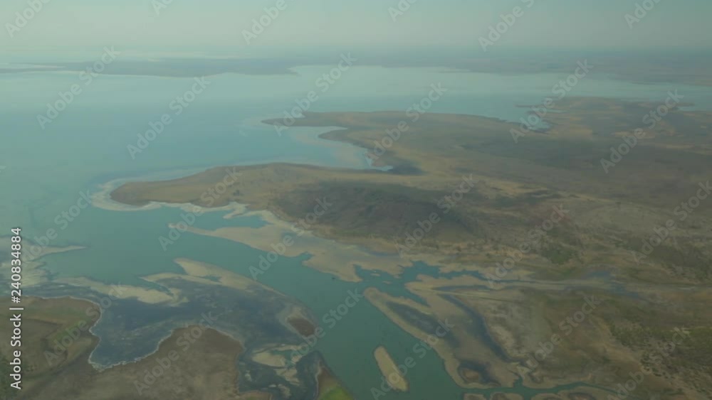 An aerial drone shot of the wilderness in Western Australia, The camera gazes over a huge lake. An aerial drone shot of the wilderness in Western Australia, The camera gazes over a huge lake.