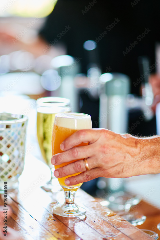 man preparing alcoholic drinks at bar