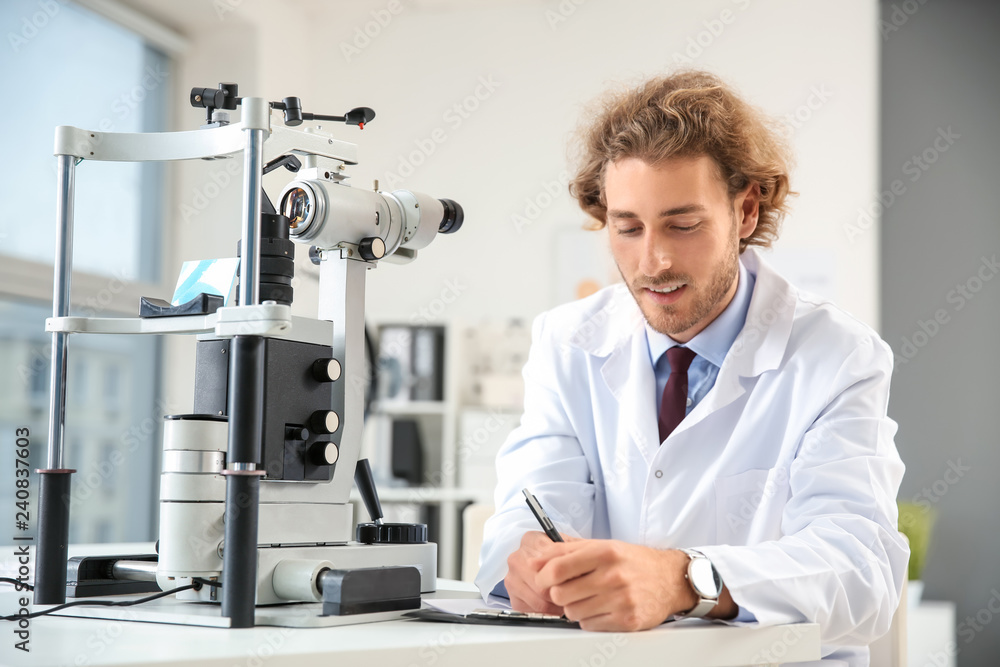 Portrait of young ophthalmologist in office Portrait of young ophthalmologist in office