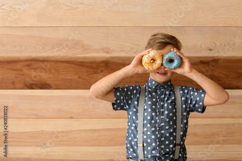 Cute little boy with donuts...