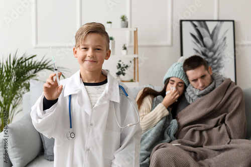 Cute little boy in doctor's...