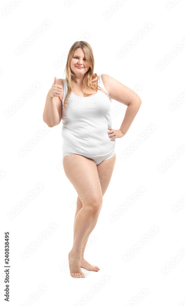 Beautiful plus size girl in underwear showing thumb-up gesture on