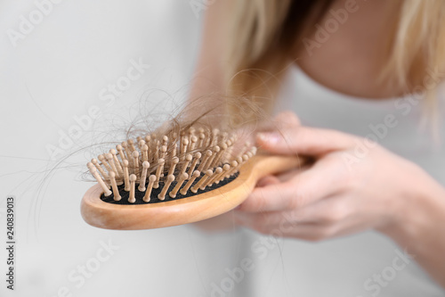 Photos Woman with hair loss problem at home, closeup