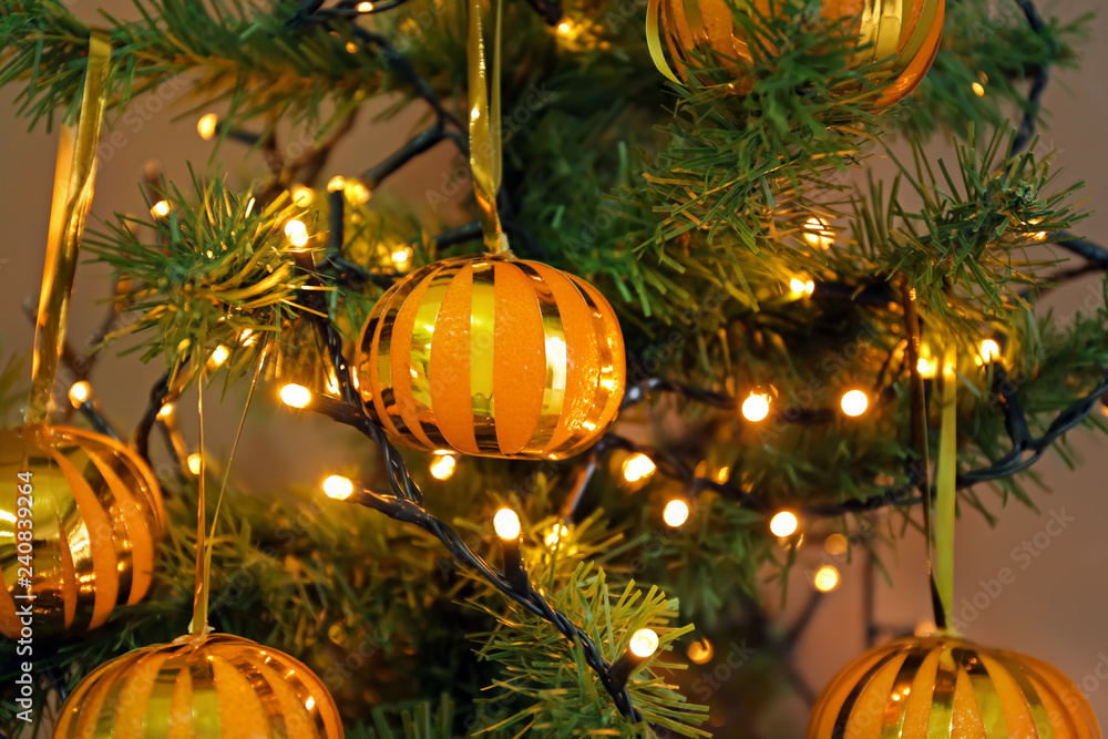 Tasty tangerines hanging on Christmas tree Tasty tangerines hanging on Christmas tree