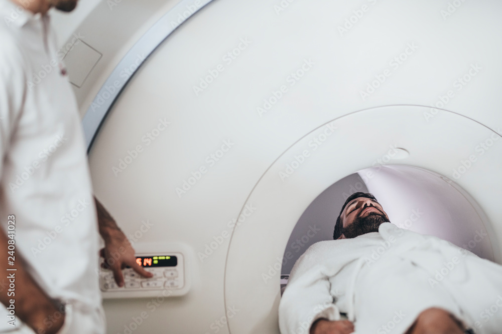 Patient Lying on the CT Scanner Bed Patient Lying on the CT Scanner Bed