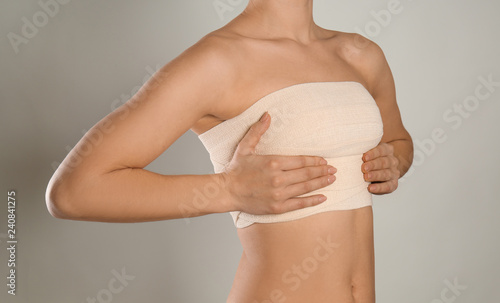 Woman with bandage on her c...