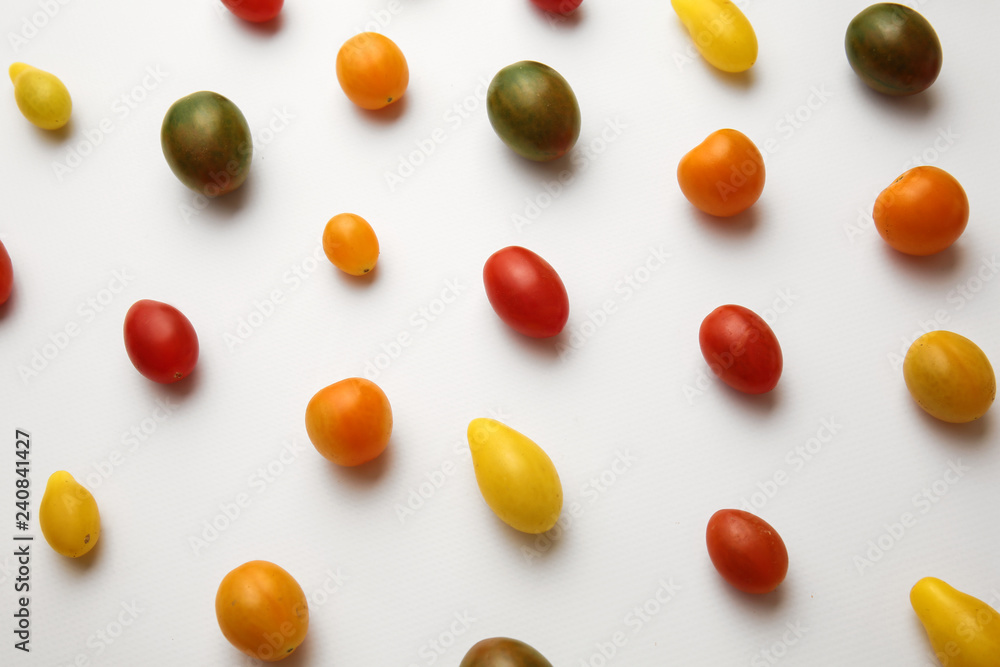 Many colorful tomatoes on white background Many colorful tomatoes on white background
