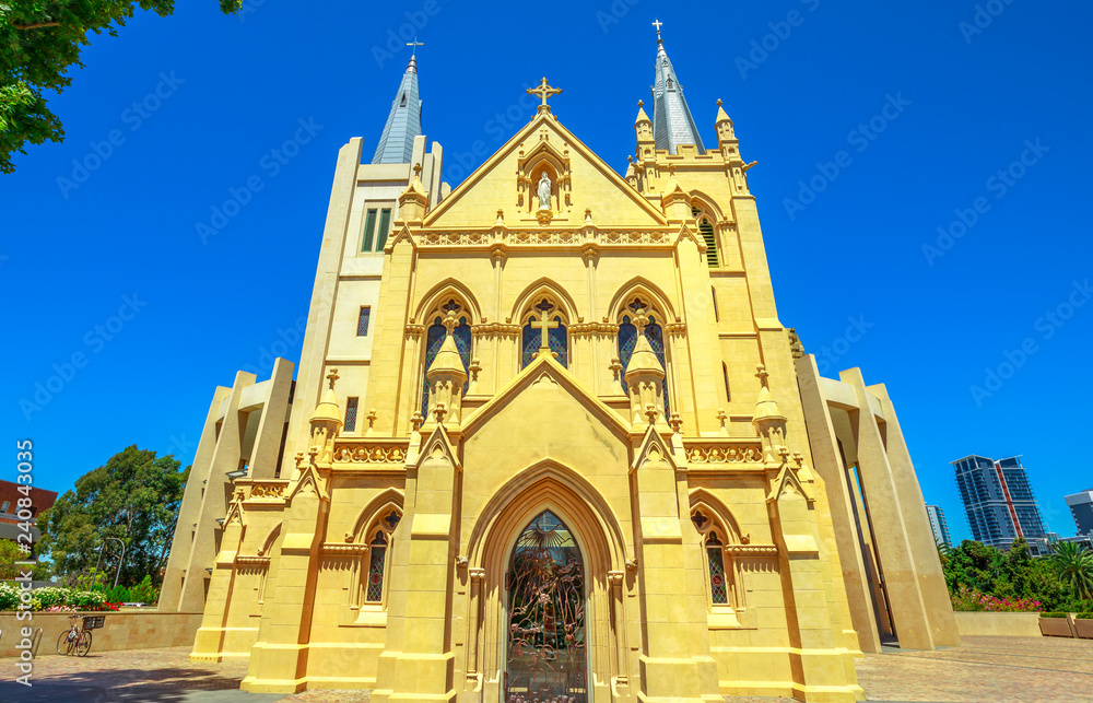 Facade of St Mary's Cathedral in Perth, Western Australia. The Cathedral of the Immaculate Conception of the Blessed Virgin Mary in neogothic style is of Christian Catholic religion. Front view.