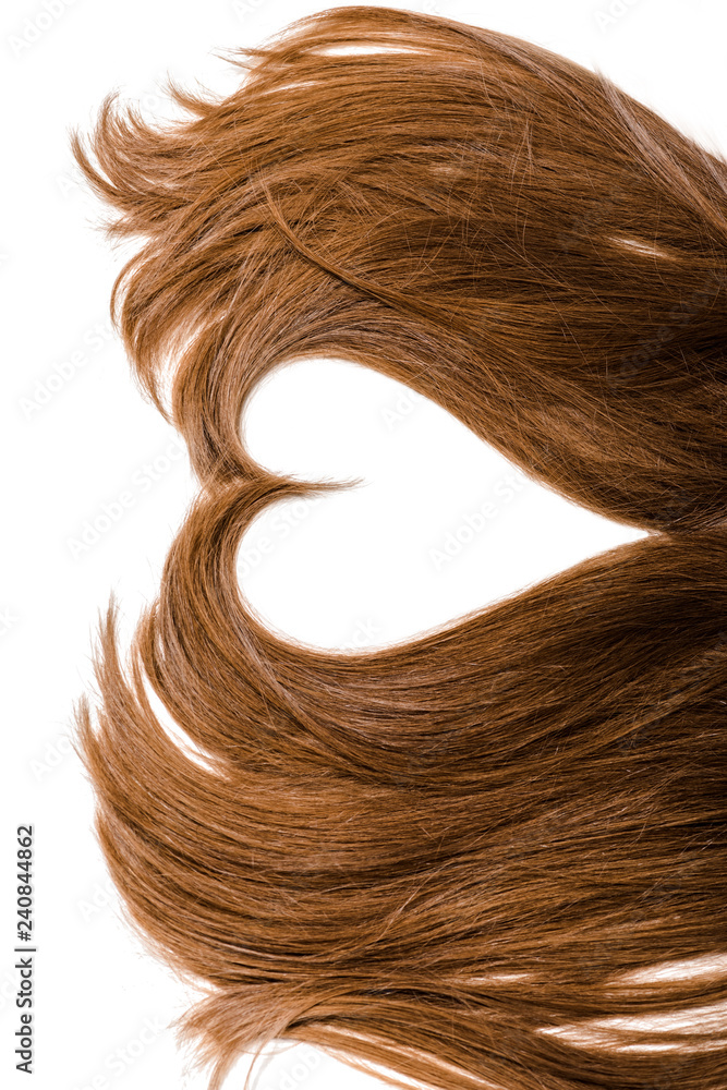 cropped view of long brown female hair in shape of heart isolated on white cropped view of long brown female hair in shape of heart isolated on white