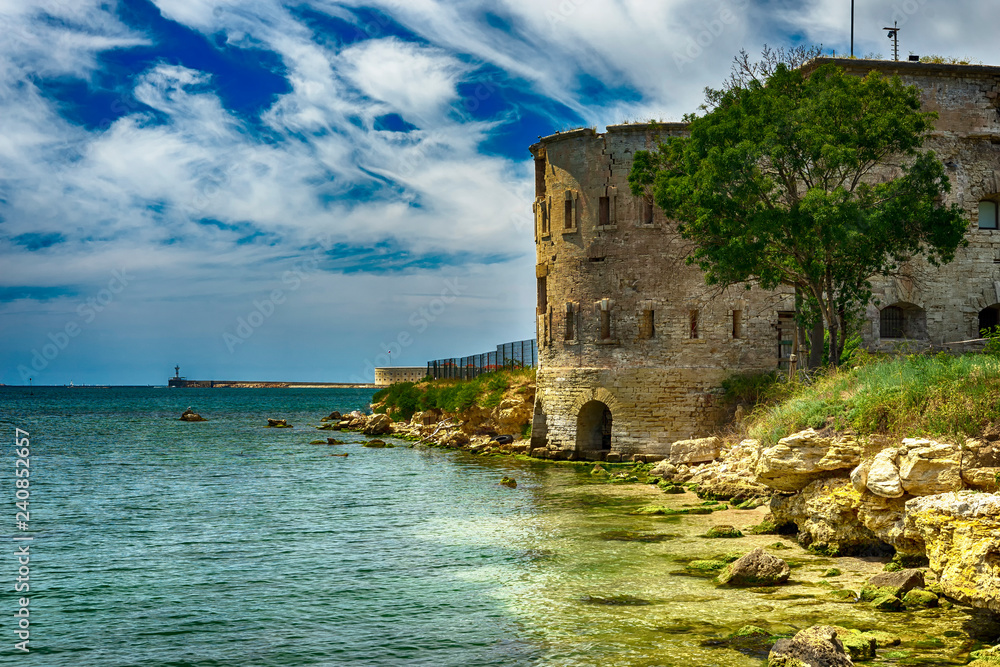 Old damaged by war fort in the Black Sea coast. Coastal Michael's fortress in Sevastopol, Crimea