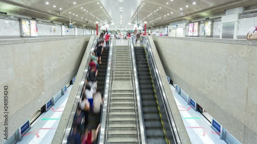 SINGAPORE - FEB 21, 2016 : 4K Timelapse of commuters on escalator at MRT Station, Singapore.