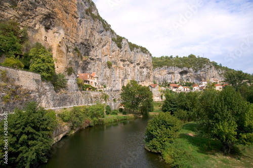 France, Quercy, Lot, quaint village houses built on the cliff above the River Cele at Cabrerets photo
