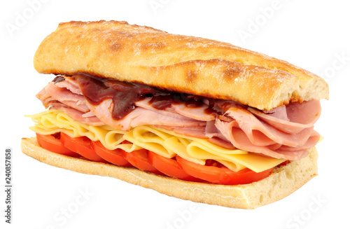 Ham and cheese crusty sandwich with tomatoes isolated on a white background