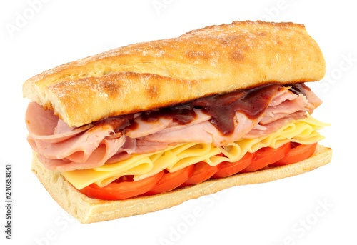 Ham and cheese crusty sandwich with tomatoes isolated on a white background