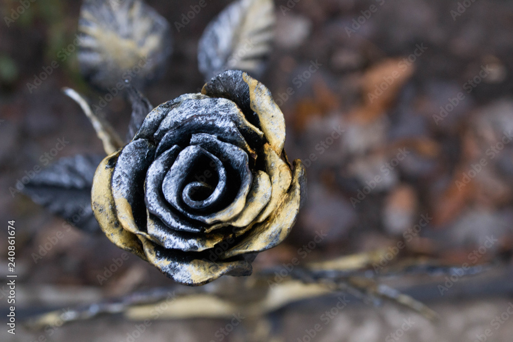 Golden forged rose in the park Golden forged rose in the park