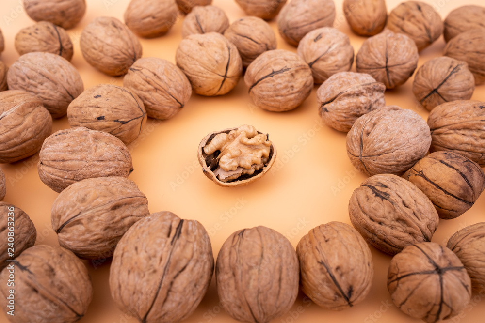 Walnuts on yellow solid background Walnuts on yellow solid background