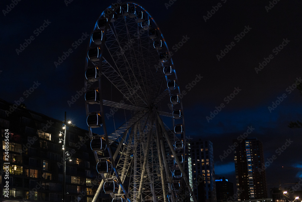 Sky View Dinner Wheel Rotterdam at Night. beautiful cityscape with the giant wheel in Rotterdam (Ferris wheel). 