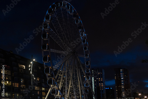 Sky View Dinner Wheel Rotterdam at Night. beautiful cityscape with the giant wheel in Rotterdam (Ferris wheel). 