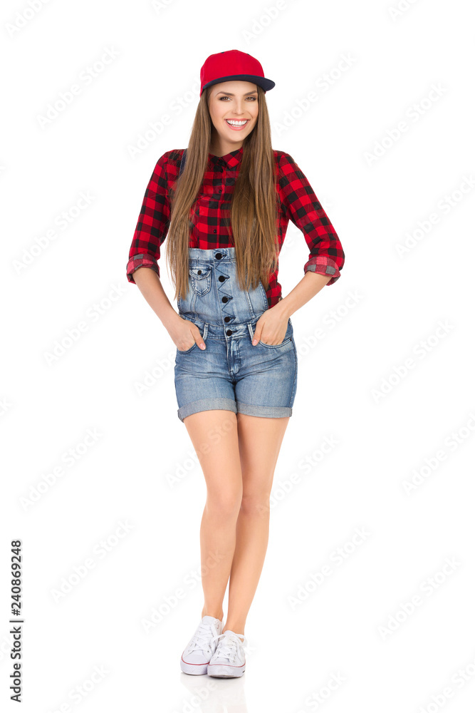 Happy Young Woman Posing In Jeans Shorts And Red Full Cap Happy Young Woman Posing In Jeans Shorts And Red Full Cap