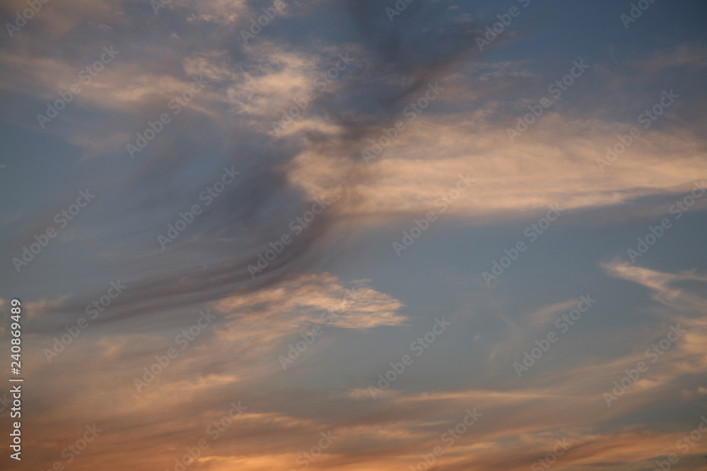 Sky clouds as the best picture. The most abstract background image of the sky. Beautiful sunset. The sun  rays illuminate the clouds.