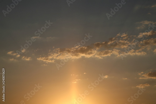 Sky clouds as the best picture. The most abstract background image of the sky. Beautiful sunset. The sun rays illuminate the clouds.