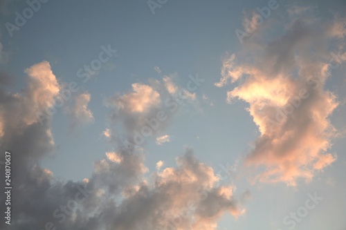 Sky clouds as the best picture. The most abstract background image of the sky. Beautiful sunset. The sun rays illuminate the clouds. © Vitaly Kartashev