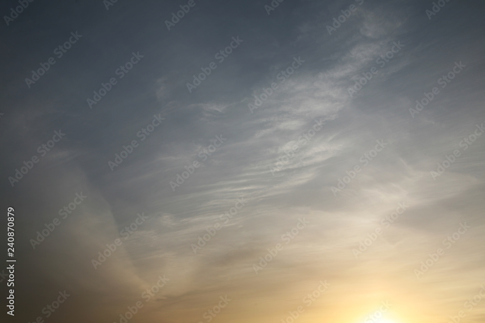 Beautiful clouds float across the blue sky. This background is illuminated by the natural light of heaven. Beautiful clouds and the sky are illuminated by bright light. Beautiful clouds float across the blue sky. This background is illuminated by the natural light of heaven. Beautiful clouds and the sky are illuminated by bright light.