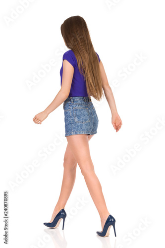 Walking Woman In Jeans Shorts And High Heels