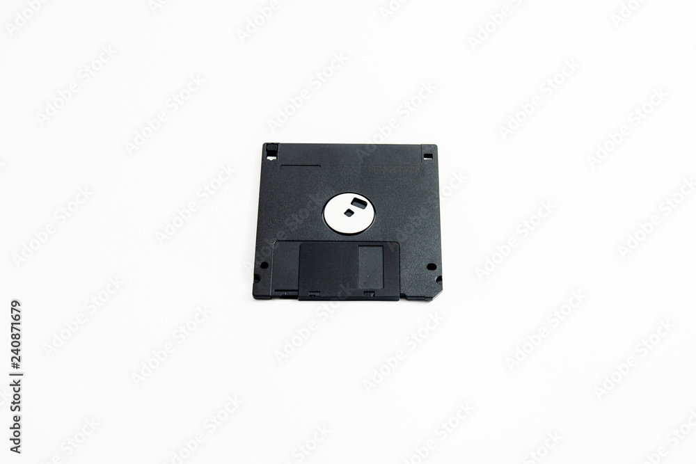 old black, single, three and a half floppy disk on white background old black, single, three and a half floppy disk on white background