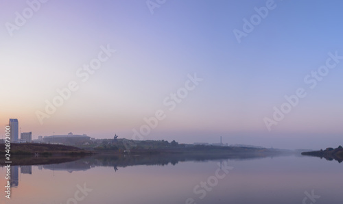 The view of the embankment of the Kalmius river in a lilac mist 2