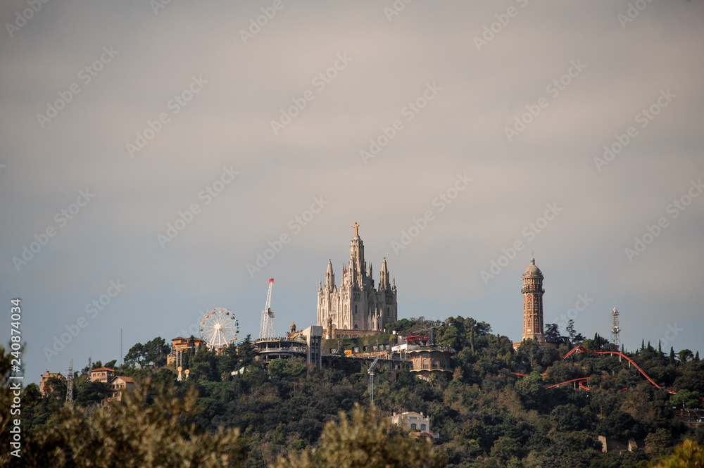 BARCELONA, SPAIN - NOVEMBER 4, 2018: Tibidabo mountain with a theme park and Expiatory Church of the Sacred Heart of Jesus