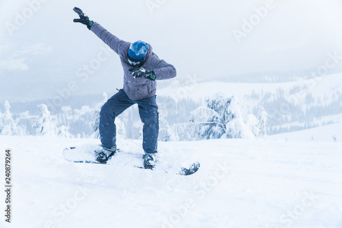 male snowboarding snowboard jump. go in the mountains on Snow Mountain winter snowboarding.