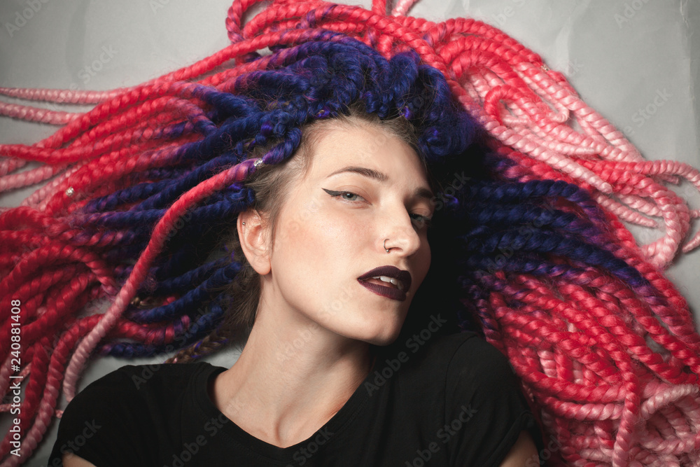 Beautiful young female with false braids. Close up Beautiful young female with false braids. Close up