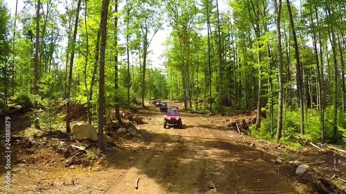 Aerial Front Follow ATV Trails between Trees in Forrest Maine