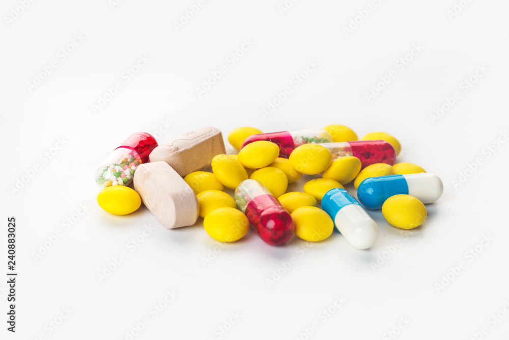 Background of assorted pharmaceutical capsules and medication in different colors Background of assorted pharmaceutical capsules and medication in different colors